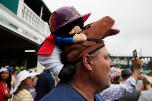 LOUISVILLE, KENTUCKY - MAY 04: A man wearing a festive hat looks on prior to the 145th running of the Kentucky Derby at Churchill Downs on May 04, 2019 in Louisville, Kentucky. (Photo by Andy Lyons/Getty Images)