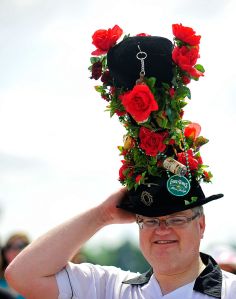 LOUISVILLE, KY - MAY 05:  A race fan wearing a decorated hat stands in the infield during the 138th running of the Kentucky Derby at Churchill Downs on May 5, 2012 in Louisville, Kentucky.  (Photo by Jamey Price/Getty Images)