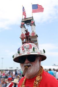 LOUISVILLE, KY - MAY 07:  A racegoer wearing a festive hat poses in the infield prior to the 142nd running of the Kentucky Derby at Churchill Downs on May 07, 2016 in Louisville, Kentucky.  (Photo by Michael Reaves/Getty Images)