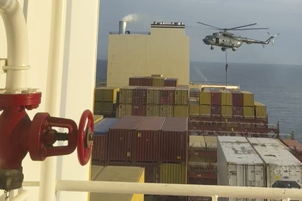 This image made from a video provided to The Associated Press by a Mideast defense official shows a helicopter raid targeting a vessel near the Strait of Hormuz on Saturday, April 13, 2024. A video seen by The Associated Press shows commandos raiding a ship near the Strait of Hormuz by helicopter Saturday, an attack a Mideast defense official attributed to Iran amid wider tensions between Tehran and the West. The Mideast defense official spoke on condition of anonymity to discuss intelligence matters.