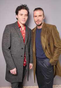 Brooklyn Beckham and David Beckham in the front row at the Louis Vuitton RTW Fall 2018.