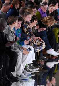 Romeo Beckham, Cruz Beckham, David Beckham and Harper Beckham  in the front row in Victoria Beckham Fall RTW 2020 show.