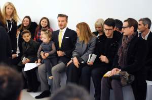 David Beckham with children Harper, Romeo and Cruz at the Victoria Beckham Fall RTW 2014 show.