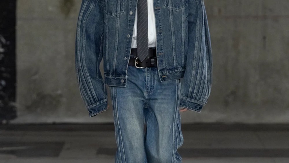 The trend blurs the line between dress and casual categories as many designers styled denim blazers and jeans in matching washes with button-down shirts and neckties.