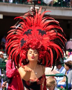 LOUISVILLE, KENTUCKY - MAY 04: A fan wearing a festive hat looks on ahead of the 150th running of the Kentucky Derby on Saturday at Churchill Downs on May 03, 2024 in Louisville, Kentucky.  (Photo by Justin Casterline/Getty Images)
