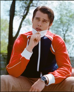 Nicholas Galitzine photographed in Bushwick for April 30, 2024. Galitzine wears Sergio Tacchini polyester track jacket; Rowing Blazers British wool herringbone pants; Jonas Studio sterling silver bracelet; Lagos black agate ring in sterling silver; Reebok sneakers.