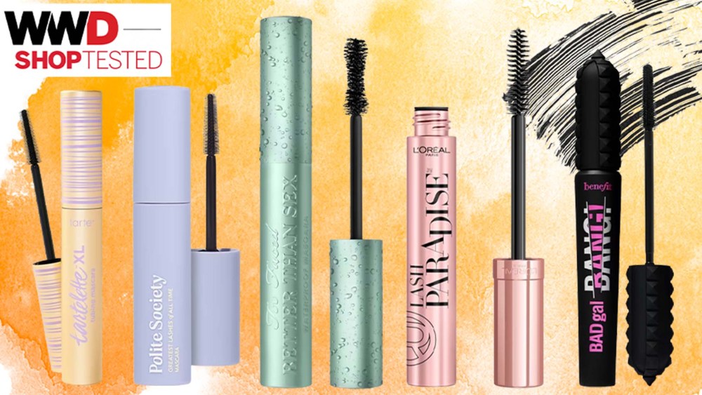 various mascara tubes over orange watercolor background