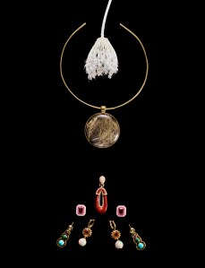 Top: Jade Ruzzo Frame Collar in 18-karat yellow gold with rutilated quartz.Single earring: Matturi Fine Jewellery Pengusa Earrings with almond face with specially cut single jasper and diamond pavé set with18-karat yellow gold. (2 earrings) Gyan Jaipur one-of-a-kind earrings 18-karat rose gold, ruby, pink sapphire and pink opal.Outside pair: Jenna Blake Morse Code Shadow Earrings in 18-karat yellow gold, diamond, amethyst, malachite and turquoise; middle pair: Harwell Godfrey Double Opal Supernova Huggie Earrings in 18-karat yellow gold with opal, fire opal and diamonds.