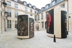 The courtyard is dotted with five mammoth columns printed with Paolo Roversi photos.