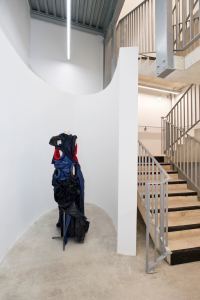A dress by Torisheju gets pride of place near a stairwell.