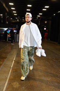 Devin Booker #1 of the Phoenix Suns arrives to the arena before the game on March 21, 2024 at Footprint Center in Phoenix, Arizona.