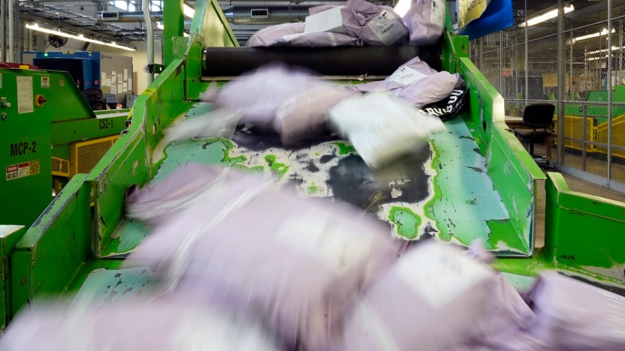 Parcels slide down a ramp after being scanned at the U.S. Customs and Border Protection overseas mail inspection facility at Chicago's O'Hare International Airport Feb. 23, 2024, in Chicago.