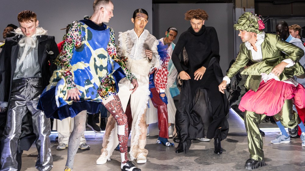 Models dancing on the runway.