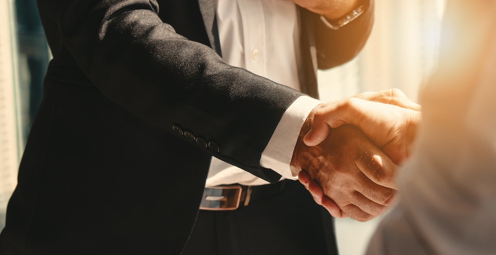 business background of businessman having handshake