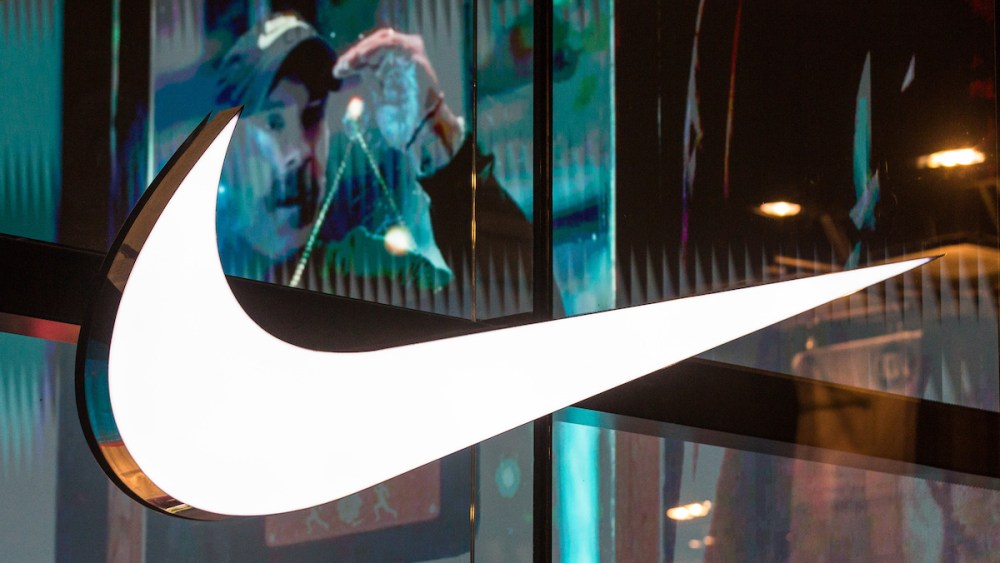 ANTWERP, BELGIUM - 2024/02/15: Illuminated trademark of the American athletic footwear and apparel corporation Nike, Inc. seen on the Nike Store window in Antwerp, Belgium. (Photo by Karol Serewis/SOPA Images/LightRocket via Getty Images)