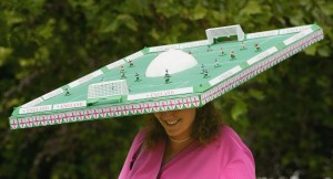 BERKSHIRE, ENGLAND - JUNE 17:  A lady wears a mini football pitch on her head during Ladies Day on the third day of Royal Ascot at the Ascot Racecourse on June 17, 2004 in Berkshire, England. The event has been one of the highlights of the racing and social calendar since 1711 with Queen Anne, and the royal patronage continues today with a Royal Procession taking place in front of the grandstands daily. (Photo by Scott Barbour/Getty Images)