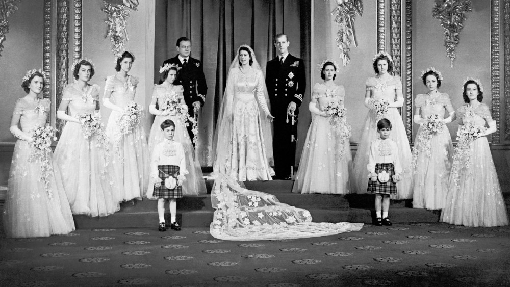 Princess Elizabeth and the Duke of Edinburgh with their eight bridesmaids in the Throne Room at Buckingham Palace.   (Photo by PA Images via Getty Images)