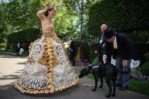 An explosive-detecting dog sniffs at a dress worn by Larisa Katz during Royal Ascot Day 3 at Ascot Racecourse on June 21, 2018 in Ascot, United Kingdom. Royal Ascot is Britain's most valuable race meeting, attracting many of the world's finest racehorses to compete for more than £7.3m in prize money.