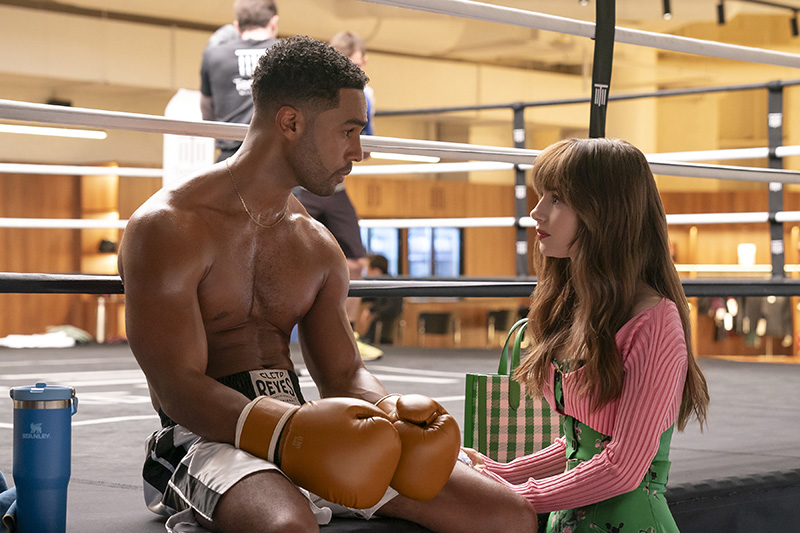 Emily in Paris. (L to R) Lucien Laviscount as Alfie, Lily Collins as Emily in Emily in Paris. Cr. Stephanie Branchu/ Netflix © 2024
