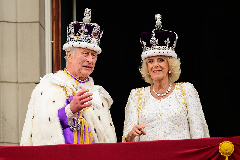 LONDON, ENGLAND - MAY 06: King Charles III and Queen Camilla wave from the balcony of Buckingham Palace during the Coronation of King Charles III and Queen Camilla on May 06, 2023 in London, England. The Coronation of Charles III and his wife, Camilla, as King and Queen of the United Kingdom of Great Britain and Northern Ireland, and the other Commonwealth realms takes place at Westminster Abbey today. Charles acceded to the throne on 8 September 2022, upon the death of his mother, Elizabeth II. (Photo by Leon Neal/Getty Images)
