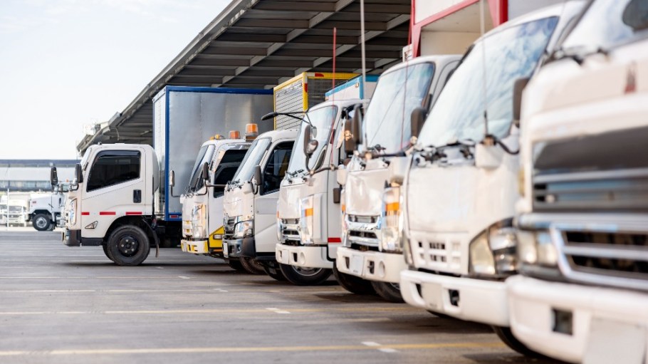 Trucks parked in a distribution warehouse.