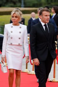 French President Emmanuel Macron and his wife Brigitte Macron arrive to attend a gala dinner hosted by the International Olympic Committee (IOC) and the French Presidency at the Louvre Museum in Paris, on the eve of the opening ceremony of the Paris 2024 Olympic Games, on July 25, 2024. (Photo by Ludovic MARIN / POOL / AFP) (Photo by LUDOVIC MARIN/POOL/AFP via Getty Images)