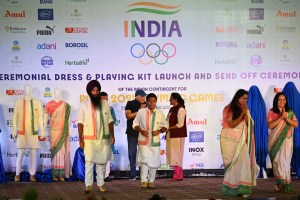 NEW DELHI, INDIA - JUNE 30: Union Minister of Youth Affairs and Sports Dr Mansukh Mandaviya, President Indian Olympic Dr. PT Usha at the launch of INDIA olympic dress and playing kit, on June 30, 2024 in New Delhi, India. During the event, Union Minister's unveiled three kits (ceremonial dress, playing kit and performance shoe & travel gear) of the Indian team. Paris Olympics bound Indian athletes were buoyant about their prospects at a ceremonial send-off organized by the Indian Olympic Association. (Photo by Salman Ali/Hindustan Times via Getty Images)