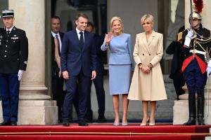 PARIS, FRANCE - JULY 26: French President Emmanuel Macron (L) and his wife Brigitte Macron (R) greet US First Lady Jill Biden (C) on arrival ahead of a reception for heads of state and governments ahead of the opening ceremony of the Paris 2024 Olympic Games, at the Elysee Presidential Palace in Paris, France on July 26, 2024. (Photo by Mustafa Yalcin/Anadolu via Getty Images)