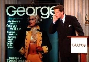 John F. Kennedy Jr. strains to hear a question during a press conference in New York to announce the launch of the new political magazine called "George" 07 September.  Kennedy will be the Editor-In-Chief of the non-partisan magazine which will spotlight the personalities that shape public issues. Fashion model Cindy Crawford poses as George Washington on the cover of the magazine.