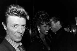 Model Iman, David Bowie and a guest attend the book party for Michael Caine's "What's It All About?" at Elaine's restaurant in New York.