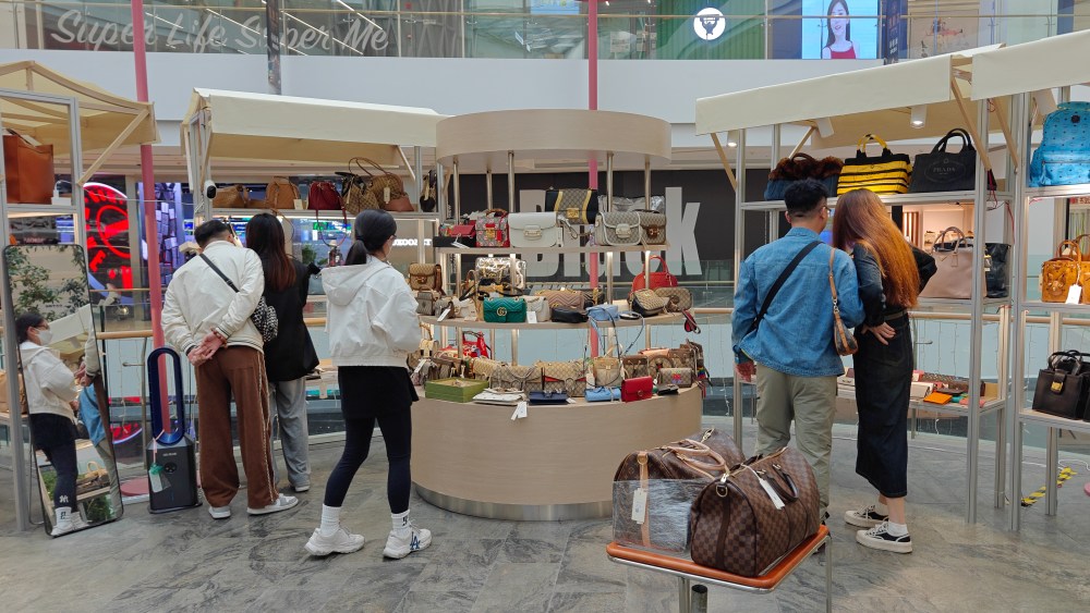 Young customers buy second-hand luxury goods at a shopping mall in Shanghai, China.