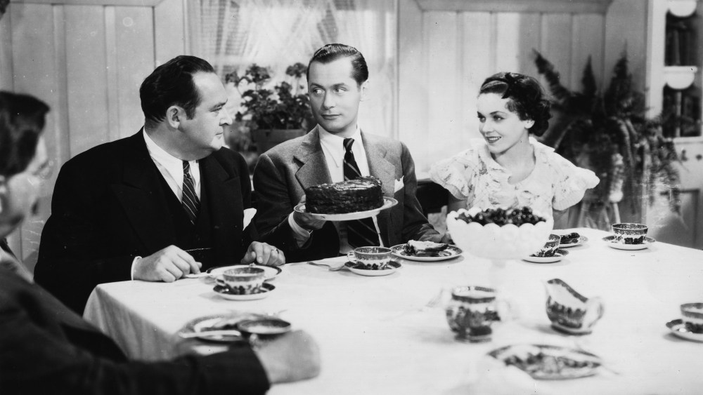 American actor Robert Montgomery (1904-1981) stars with Maureen O'Sullivan and Edward Arnold (1890-1956) in the fugitive drama "Hideout," directed by W. S. Van Dyke for MGM.