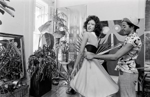 Stephen Burrows fits a wrap dress from his fall 1971 collection on model and muse Pat Cleveland in his New York loft.