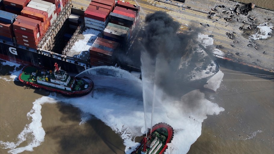 Aerial view of a rescue boat putting out fire after a powerful explosion hit a container ship berthed at the Ningbo-Zhoushan Port on August 9, 2024 in Ningbo, Zhejiang Province of China. Currently, no casualties or injuries have been reported.