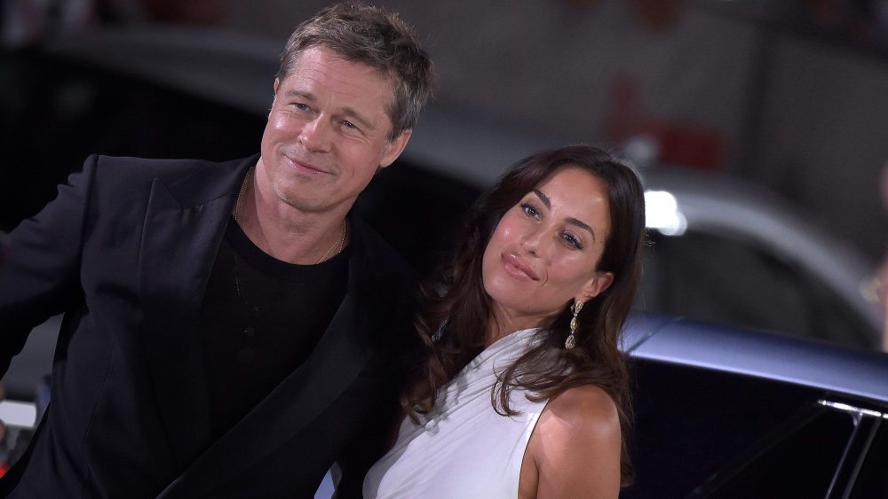 Brad Pitt and Ines de Ramon attend the “Wolfs” premiere during the 2024 Venice Film Festival on Sept. 1, red carpet, Entire Studios, white one-shoulder dress