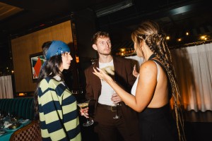 Leah McCarthy, Patrick Dooley and Natasha Poonawalla at the Gigi Hadid & Caviar Kaspia Dinner held at Caviar Kaspia during New York Fashion Week on September 5, 2024 in New York, New York.
