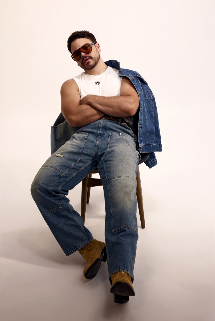 Marine Serre tank top, Moschino jeans, Wrangler jacket, Louis Vuitton Men’s boots, Schott belt, Tom Ford sunglasses.