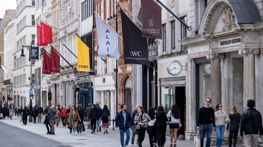 Art gallery and fashion retailers flags on Bond Street in London, United Kingdom. Bond Street is one of the principal streets in the West End shopping district and is very upmarket. It has been a fashionable shopping street since the 18th century.