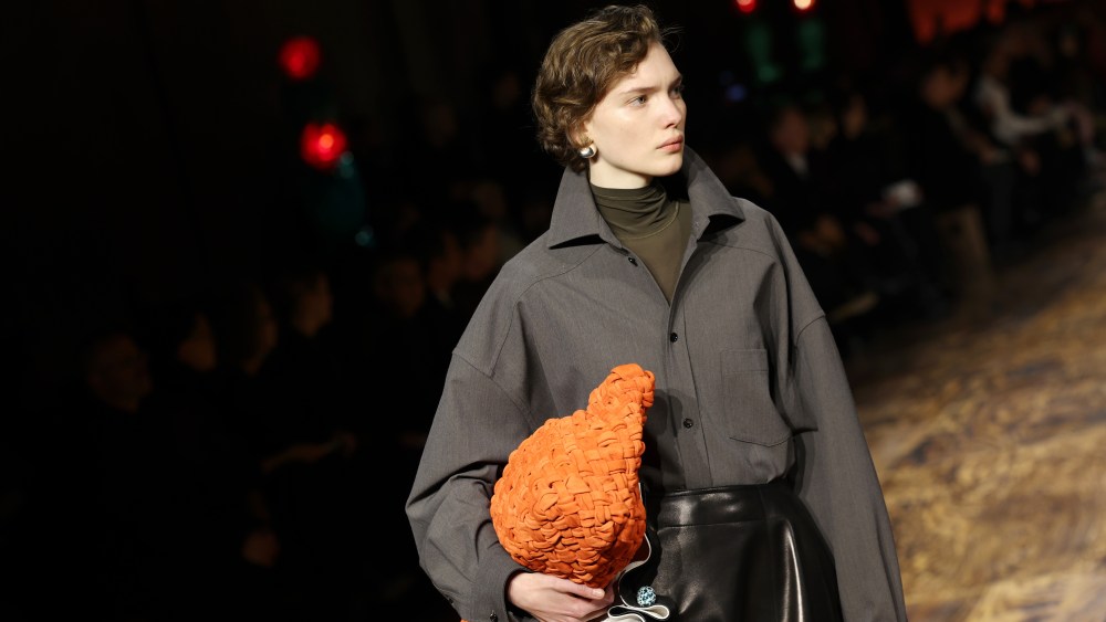 A model walks the runway at the Bottega Veneta fall 2024 fashion show with the best accessories of the season