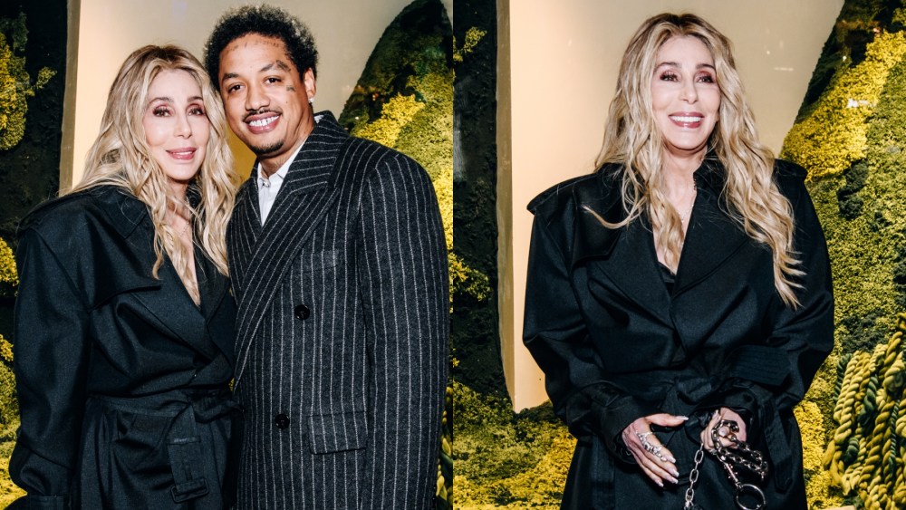 Cher and boyfriend Alexander Edwards at the Burberry flagship store reopening on Oct. 16 in New York, trench coat, pinstripe suit