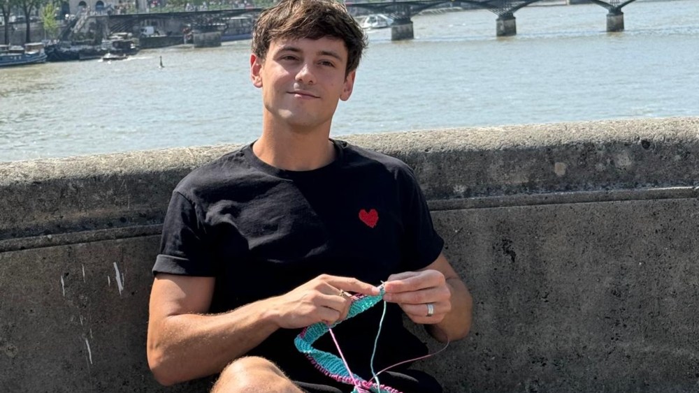 Tom Daley practices his knitting in Paris.