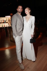 Deven Marrero and Hayley Sullivan at the Giorgio Armani Spring 2025 Ready-to-Wear show