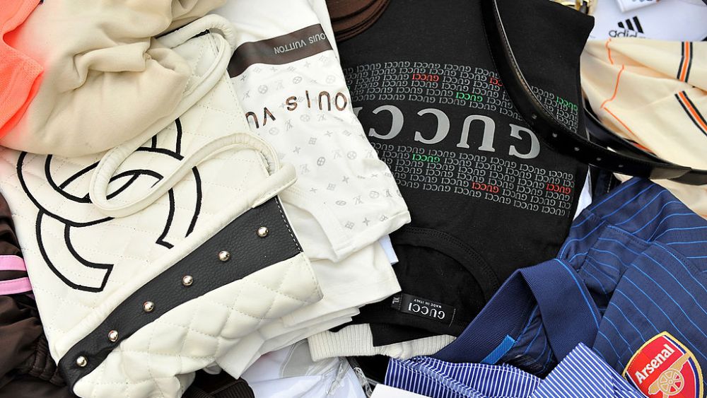 Counterfeit handbags and shirts seized by Customs are displayed at Ministere des Finances on April 22, 2010 in Paris, France. France's Budget Minister, Francois Baroin attended a press conference there today to announce Customs results for 2009.  (Photo by Pascal Le Segretain/Getty Images)