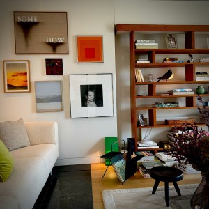 I’m fascinated by art and surrounded by it at home. Here, you can see paintings by Ed Ruscha, Sharon Stone, or Joseph Albers, photography by Robert Mapplethorpe, furniture by Charlotte Perriand, and a Pigeon lamp by Lalanne, I love to feel poetry and coziness at home.