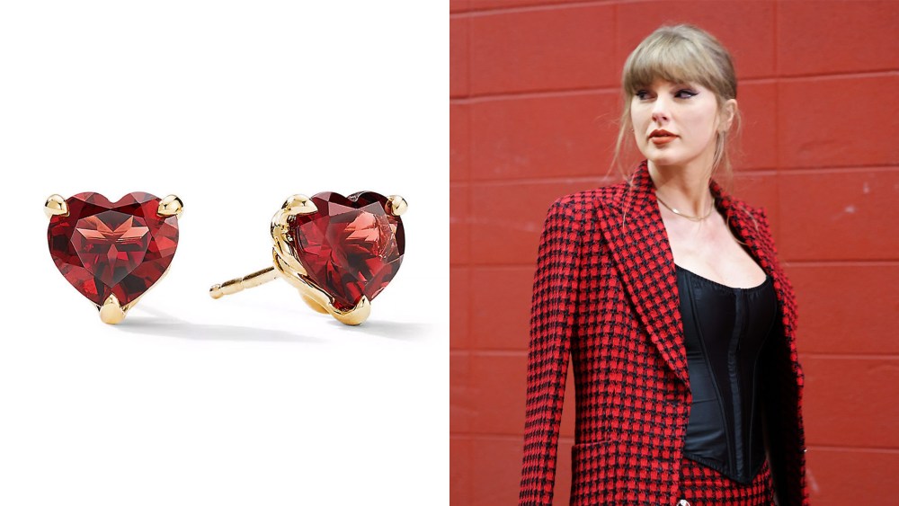 red heart earrings; woman against a red background