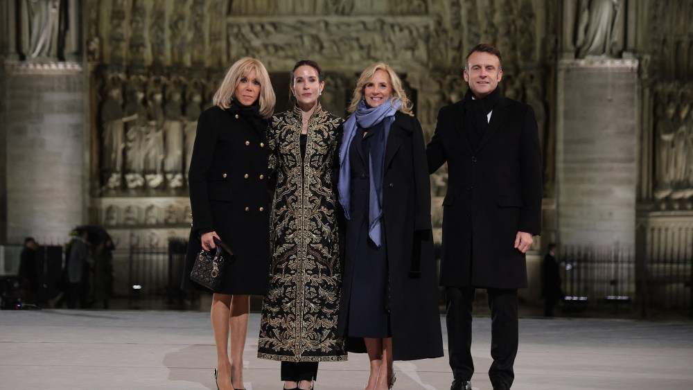 French President Emmanuel Macron (R) and his wife Brigitte Macron (L) pose with First Lady of the United States Jill Biden (CR) and her daughter Ashley Biden (CL) outside Notre-Dame Cathedral ahead of a ceremony to mark the re-opening of the landmark cathedral, in central, Paris on December 7, 2024.