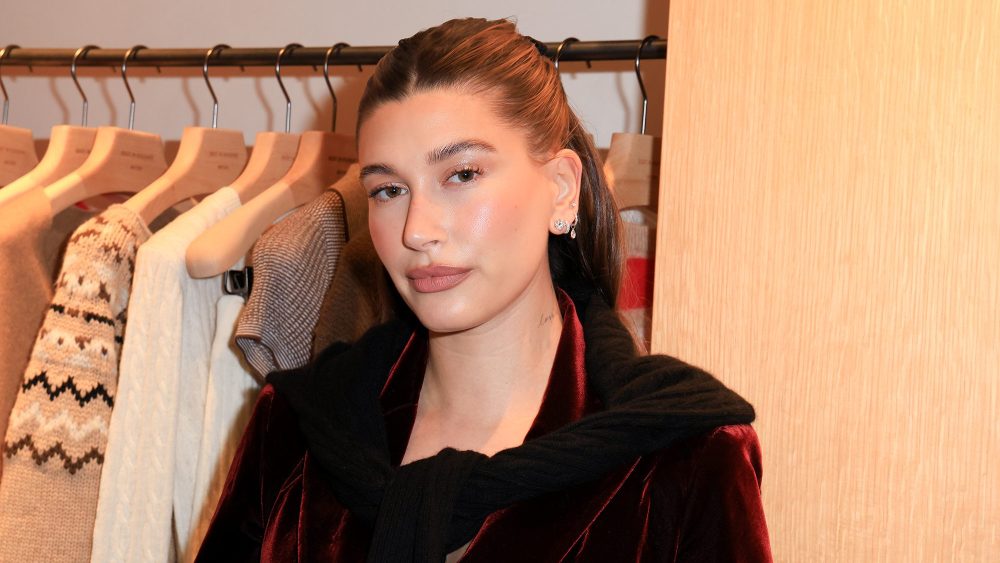 Hailey Bieber at Guest In Residence's Los Angeles store opening on Dec. 7, maroon velvet skirt suit, Tom Ford, Yves Saint Laurent
