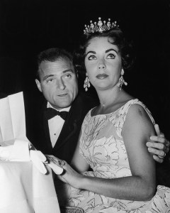 Elizabeth Taylor sits at a Golden Globe Awards ceremony at the Coconut Grove nightclub, Hollywood, California, 1957.