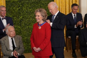 Hillary Clinton receives the Medal of Freedom from United States President Joe Biden during a ceremony at the White House in Washington, DC, January 4, 2025. (Photo by Chris Kleponis / AFP)