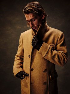 Polo Ralph Lauren camel hair coat, wool sweater and cotton poplin shirt; John Varvatos leather lace-up boots.